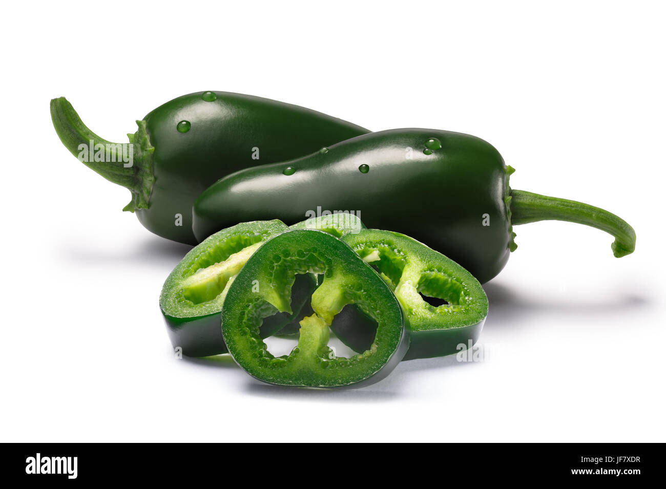 Jalapeno chile peppers sliced seedless and whole pod, immature (green). Clipping paths, shadows