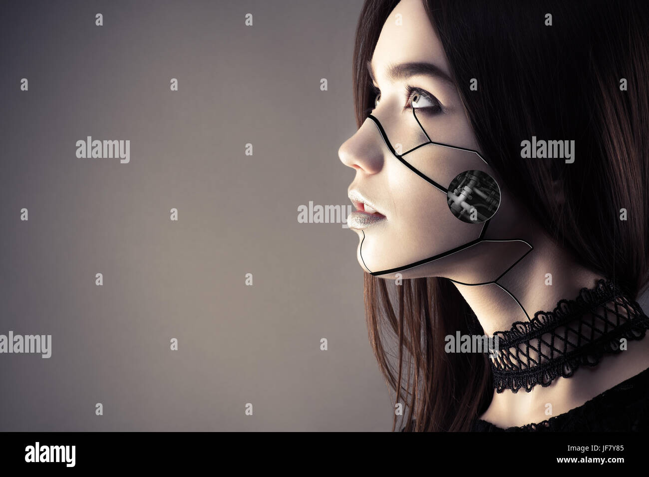 beautiful cyberpunk girl with fashion makeup looking up Stock Photo