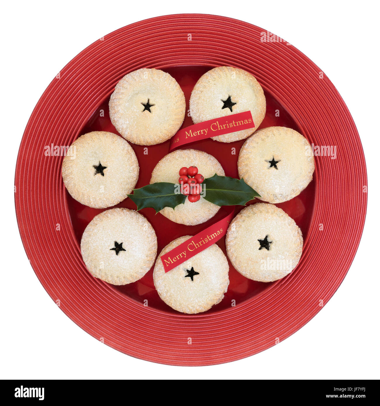 Mince pies with holly and red merry christmas ribbon on a plate ...