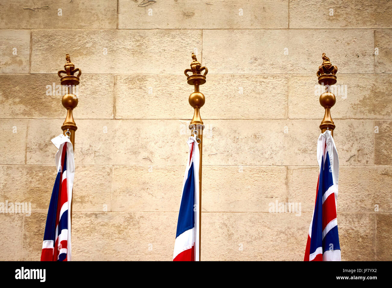 The tops of the White Ensign, Union Flag and Blue Ensign on the Cenotaph on Whitehall in London Stock Photo
