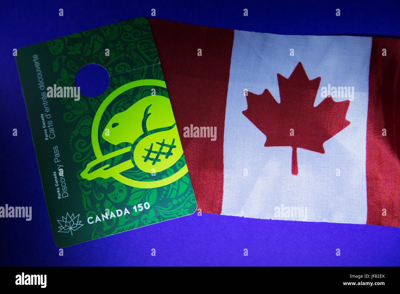 A Parks Canada Discovery Pass and Canadian flag Stock Photo Alamy