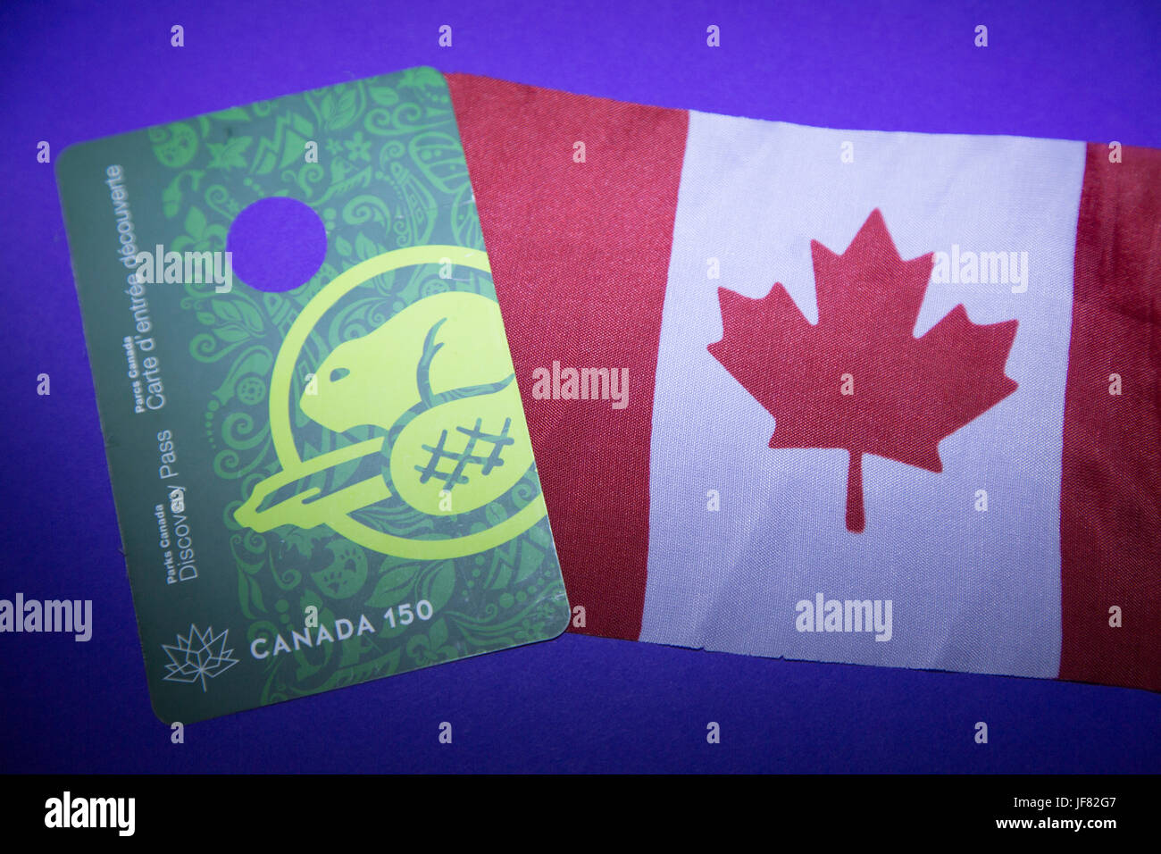 A Parks Canada Discovery Pass and Canadian flag Stock Photo Alamy