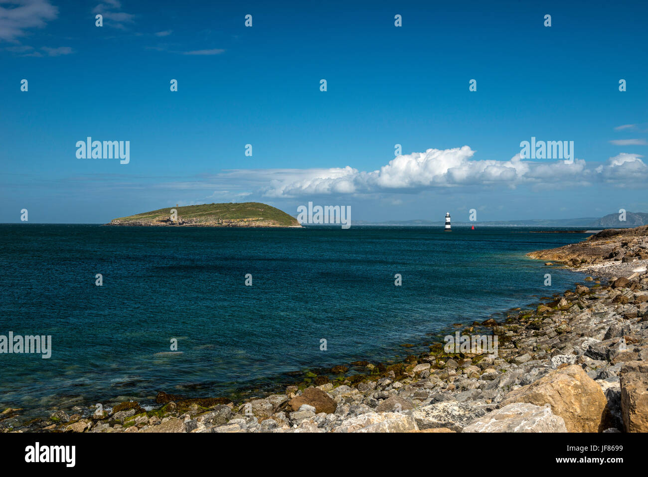 Beautiful seascape depicting North Wales coastal features, (Moel Wnion, Foel Ganol, Cefn Maen Amor, Conway Peninsula) on summers day with blue skies. Stock Photo