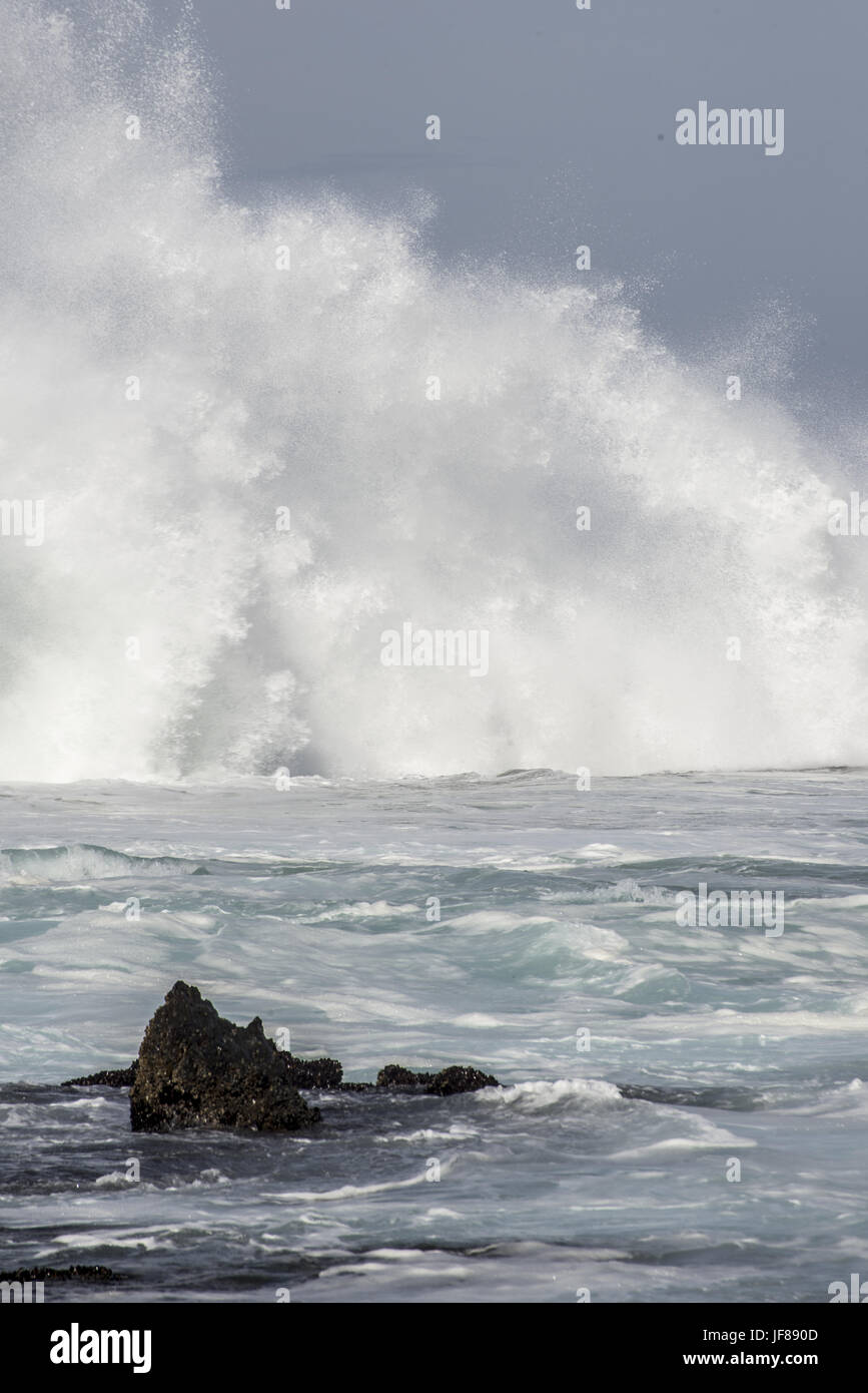 Wave Crashing near Rocks Stock Photo