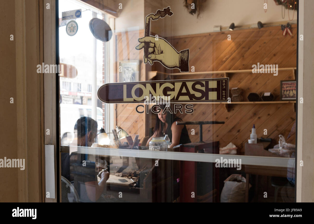 Entrance glass door to the Longash cigar making store in Ybor City