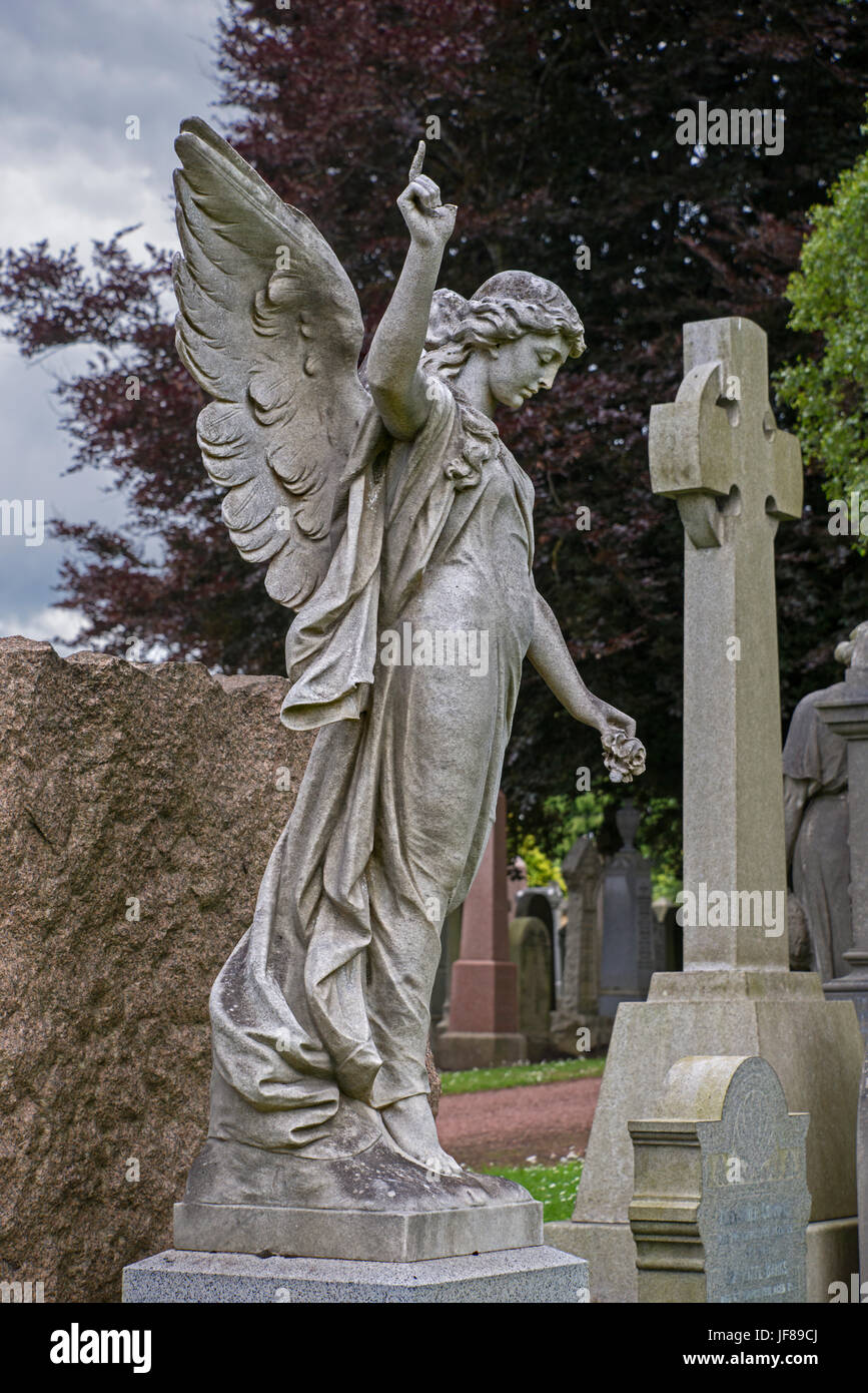 An angel holds a rose and points to the heavens in Grange Cemetery, Edinburgh. Stock Photo