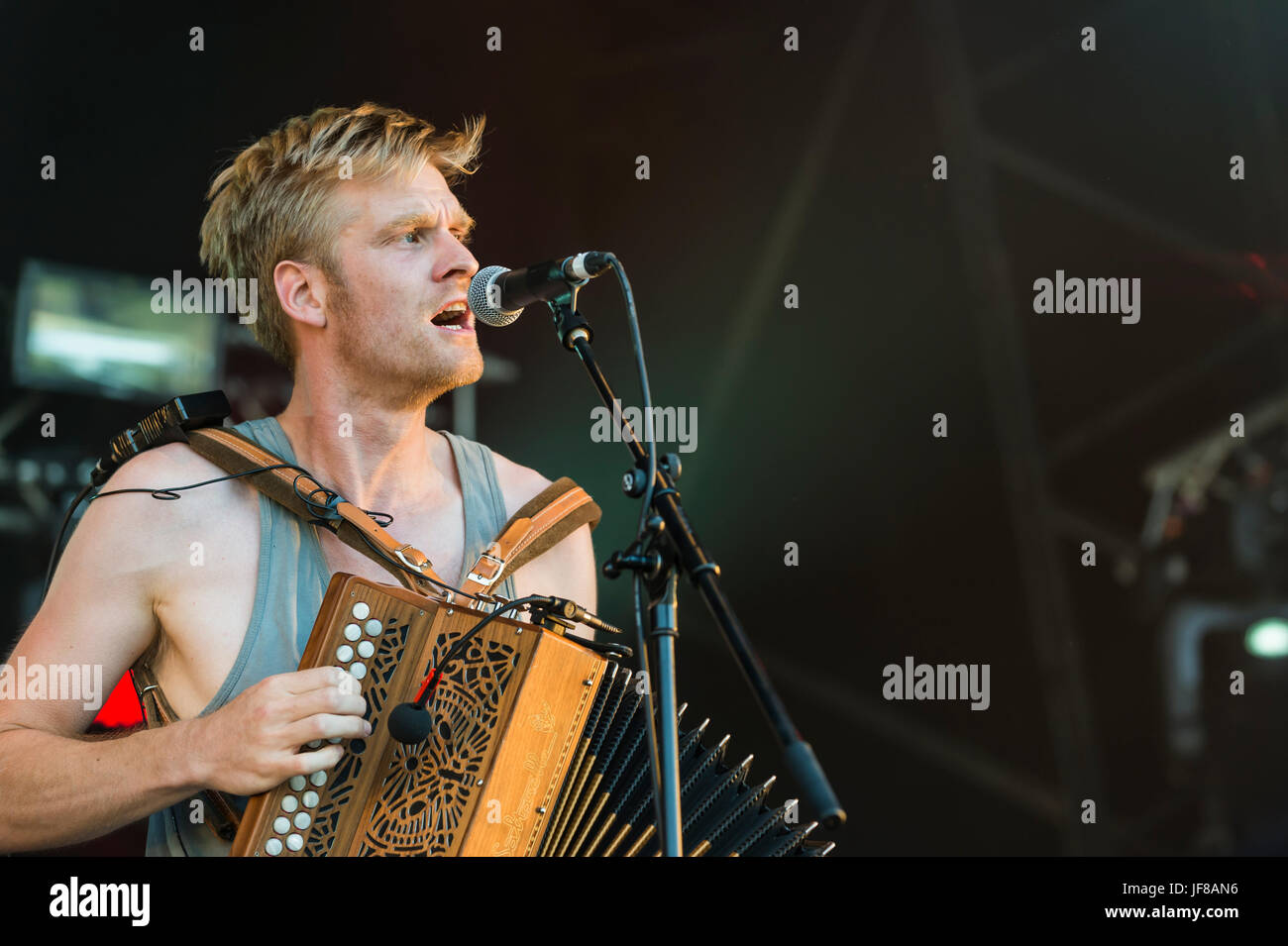 Dundrennan Scotland, UK - July 25, 2014: Maxwell Thomas of Skinny Lister, performing at the Wickerman Festival Stock Photo