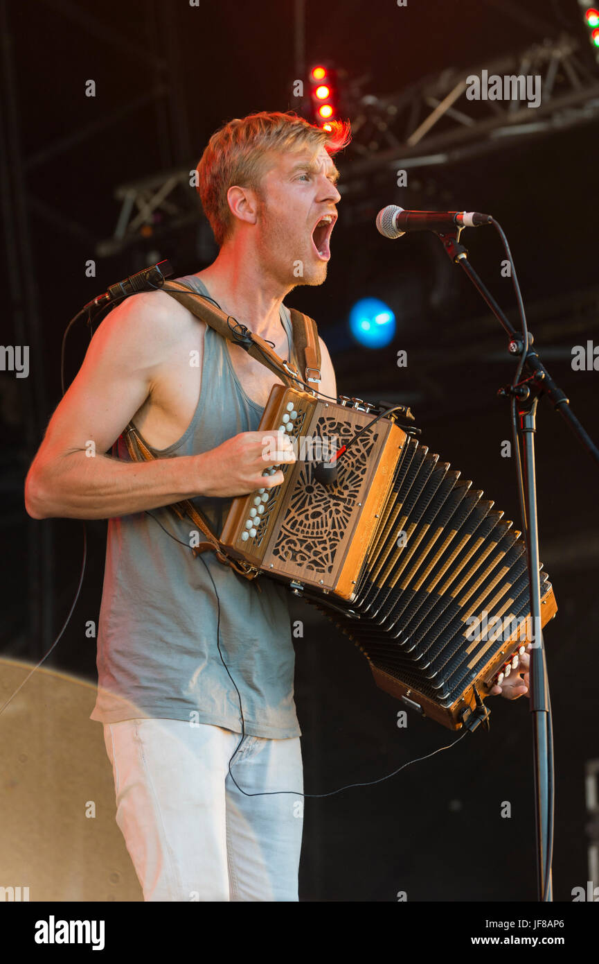 Dundrennan Scotland, UK - July 25, 2014: Maxwell Thomas of Skinny Lister, performing at the Wickerman Festival Stock Photo