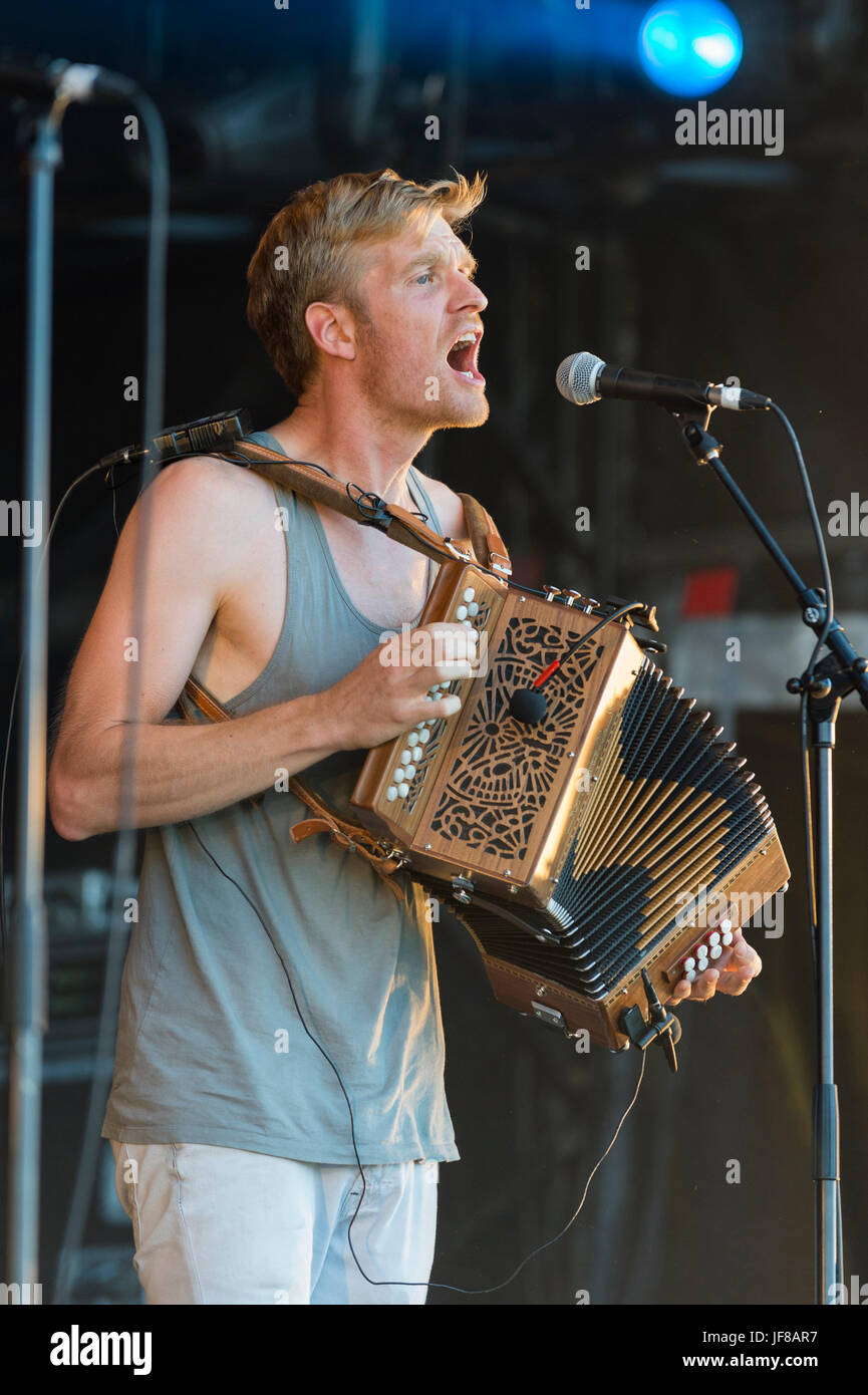 Dundrennan Scotland, UK - July 25, 2014: Maxwell Thomas of Skinny Lister, performing at the Wickerman Festival Stock Photo