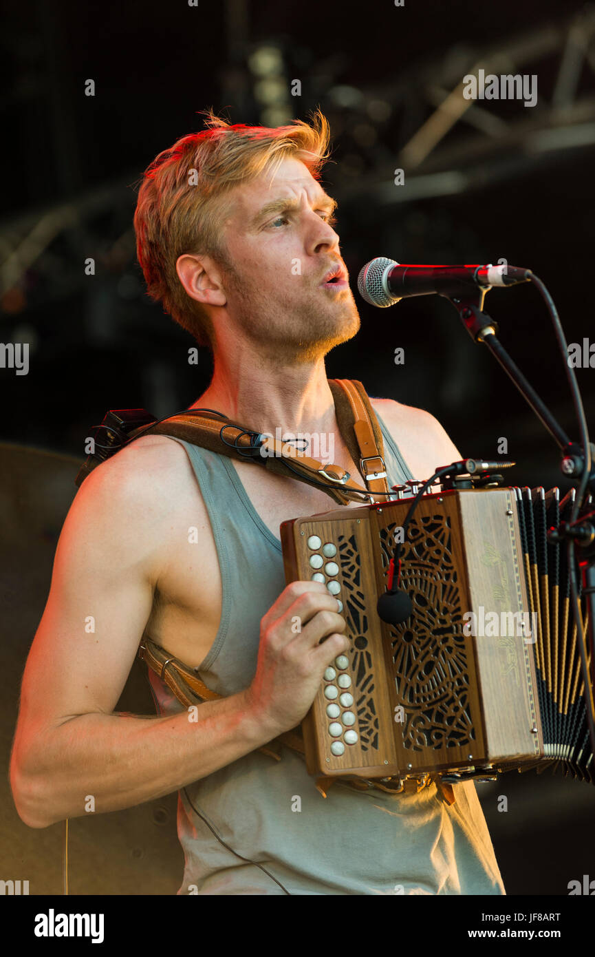 Dundrennan Scotland, UK - July 25, 2014: Maxwell Thomas of Skinny Lister, performing at the Wickerman Festival Stock Photo