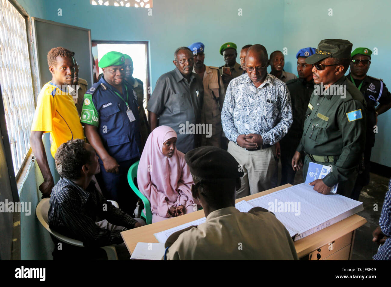 Dr. Opiyo Ododo (left), the head of stabilisation and early recovery of the African Union Mission in Somalia (AMISOM), Ahmed Nasir, the Jubbaland Police commissioner, and the African Union Mission in Somalia (AMISOM) Police Training Coordinator, Assistant Commissioner of Police (ACP) Francis Ayitey Aryee, attend the handover of the newly renovated police station to Jubbaland Administration on May 8, 2017. AMISOM Photo Stock Photo