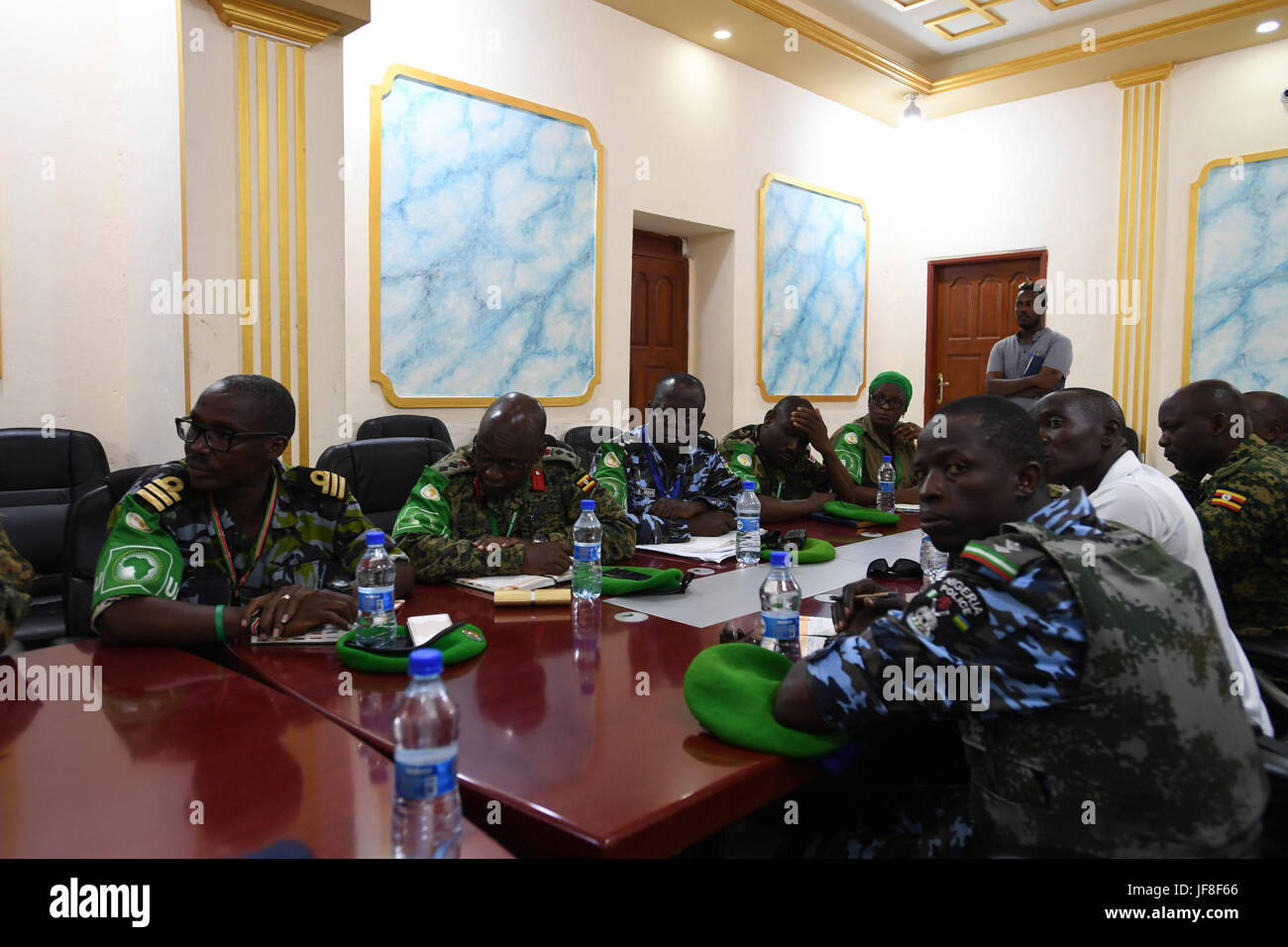 Senior officers of the African Union Mission in Somalia (AMISOM) attend a meeting with officials of the Benadir Regional Administration at the Mogadishu City Headquarters, Somalia on May 13, 2017. AMISOM Photo / Omar Abdisalan Stock Photo