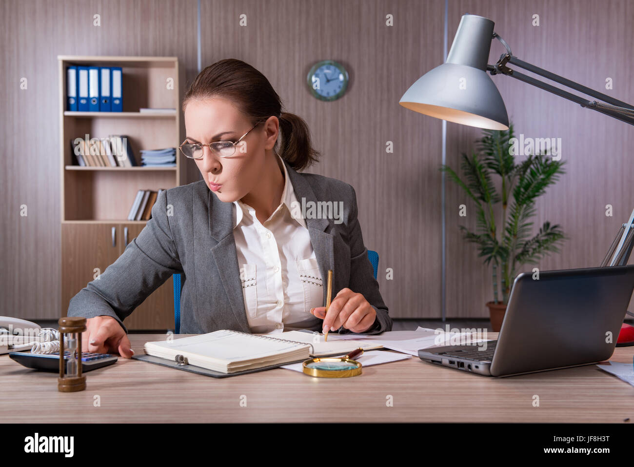 Businesswoman working in the office Stock Photo - Alamy