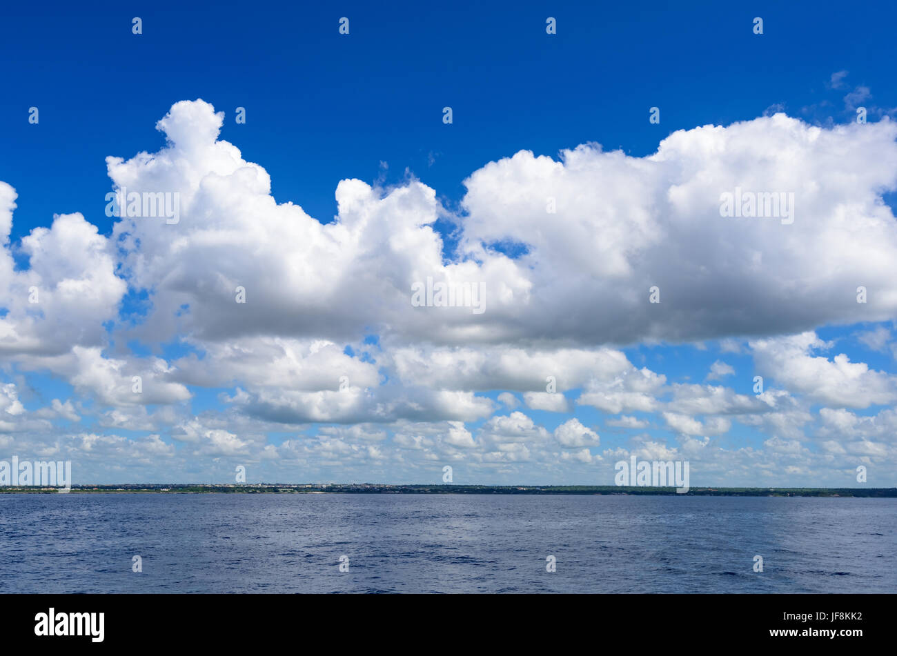 open blue sea cumulus clouds Stock Photo