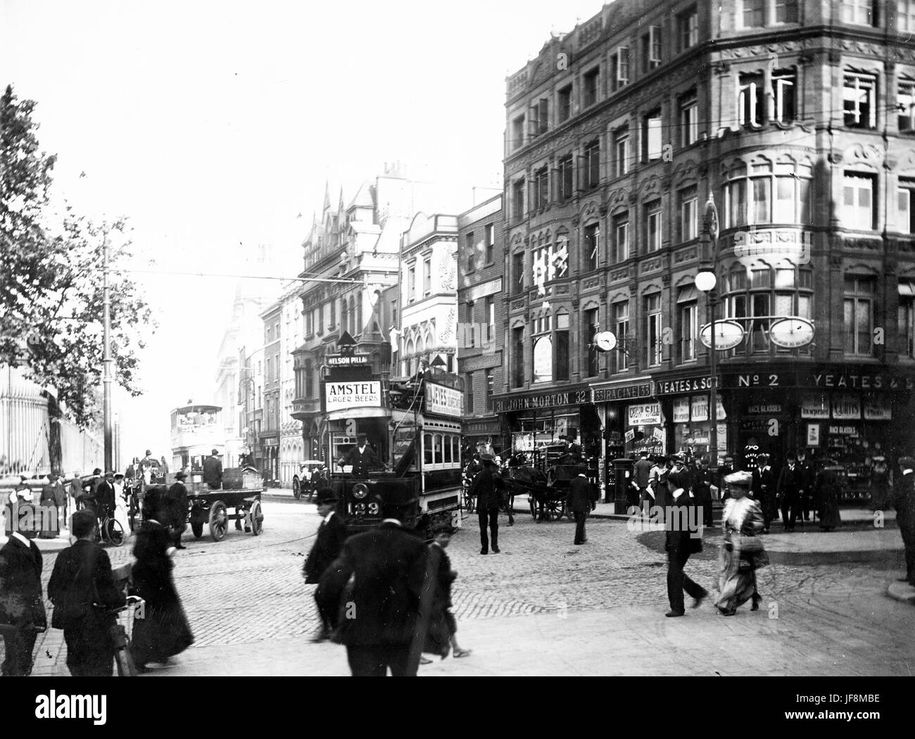 Trams and pedestrians on Nassau Street, viewed from Grafton Street 34452143730 o Stock Photo