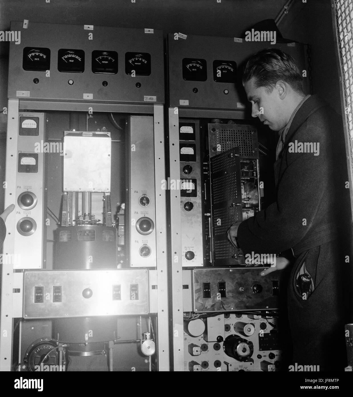 Television Transmitter Being Installed into the Helsinki Olympic Stadium, Helsinki, Olympic Stadium, Television Transmitter, Installation, Vintage, Yle Archives, Broadcasting, Technology, Historical Photography, Sports History, Olympic Games, Finland, Yle Arkisto, Television History, 1960s, Technology Evolution, Broadcast History, Stadium, Iconic Venue, Finnish History, Communication, Media History, Vintage Technology, Media Industry, Television Revolution, Finnish Culture, Cultural Landmark, Global Sports, Olympic Legacy, Television Signal, Transmission, Historical Moment Stock Photo