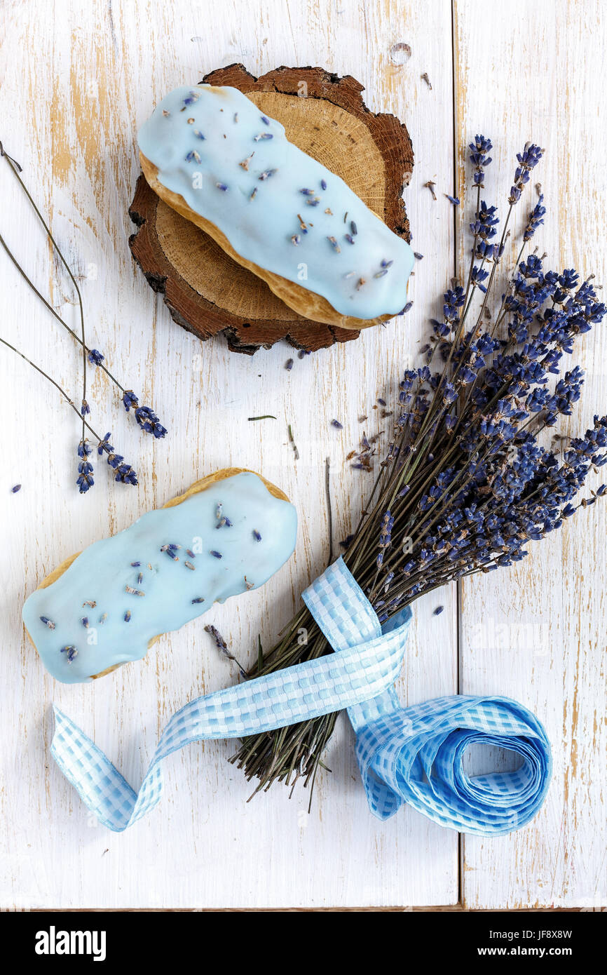 Delicious eclairs with Lavender Stock Photo - Alamy
