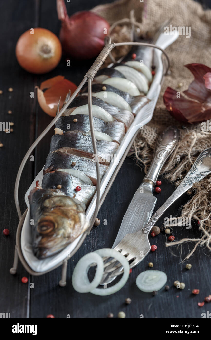 Salted herring with onions and spices Stock Photo Alamy
