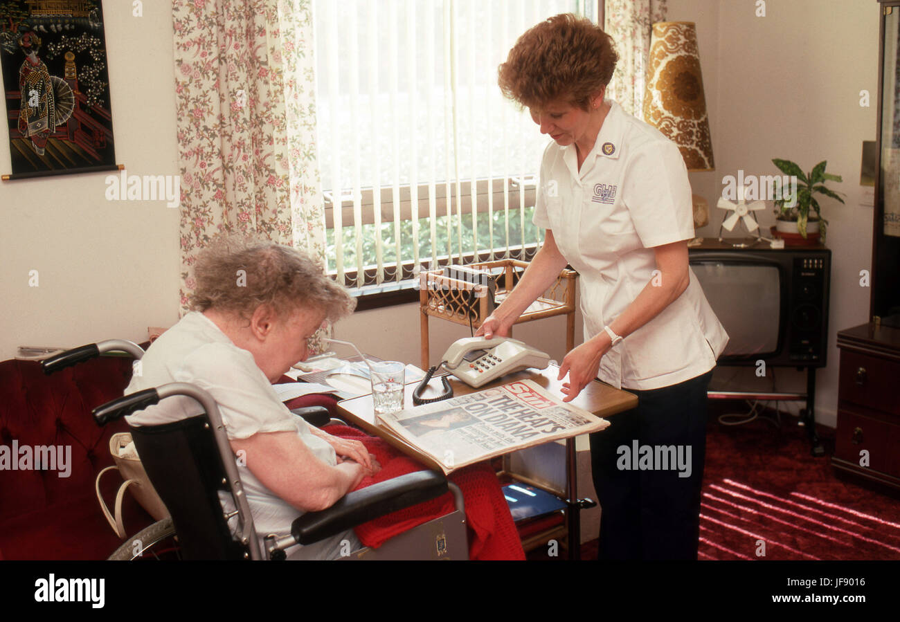 Carer with elderly woman in wheelchair Stock Photo