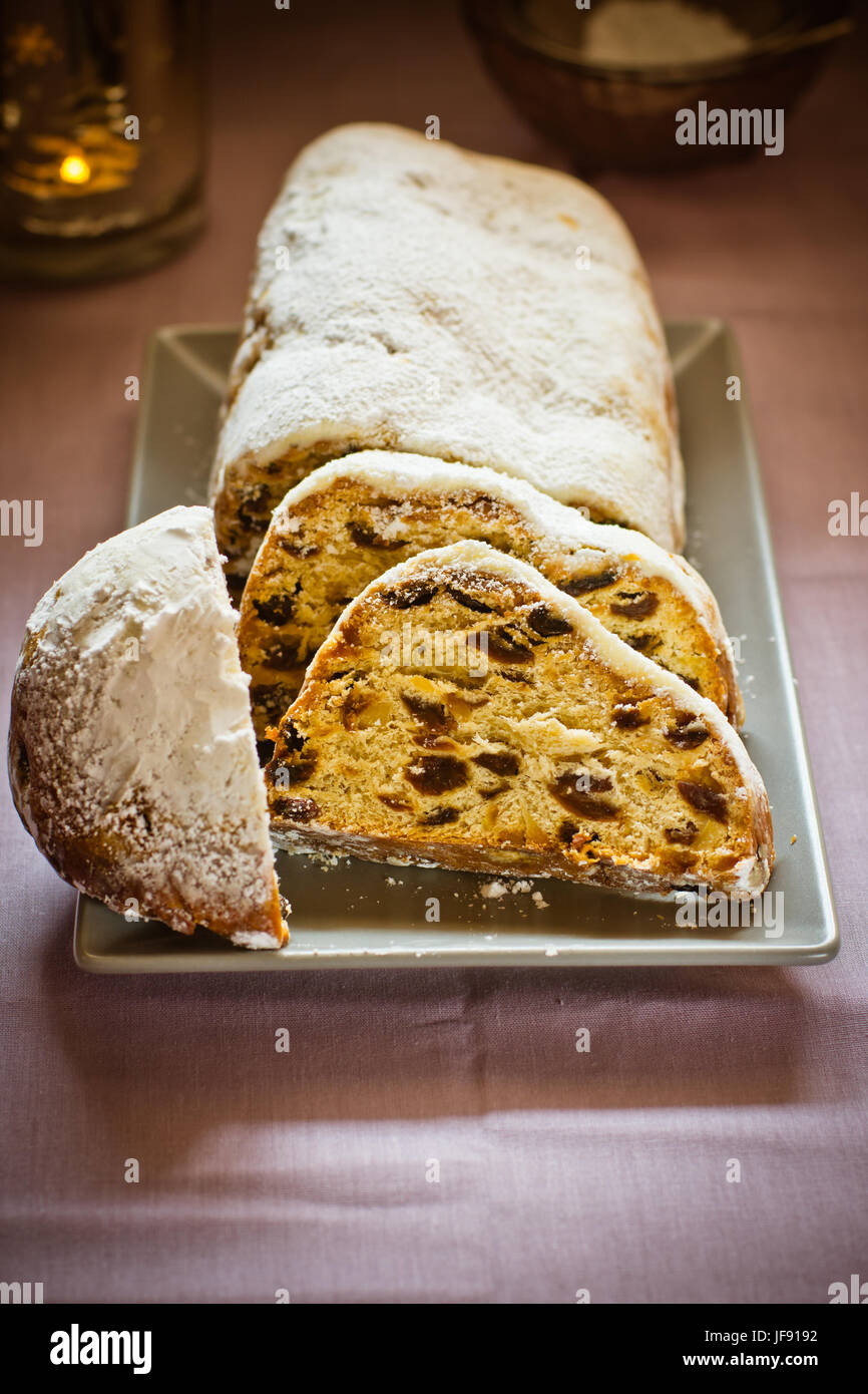 Traditional German Christmas stollen with raisins, nuts, candied ... Traditional German Christmas stollen with raisins, nuts, candied ...