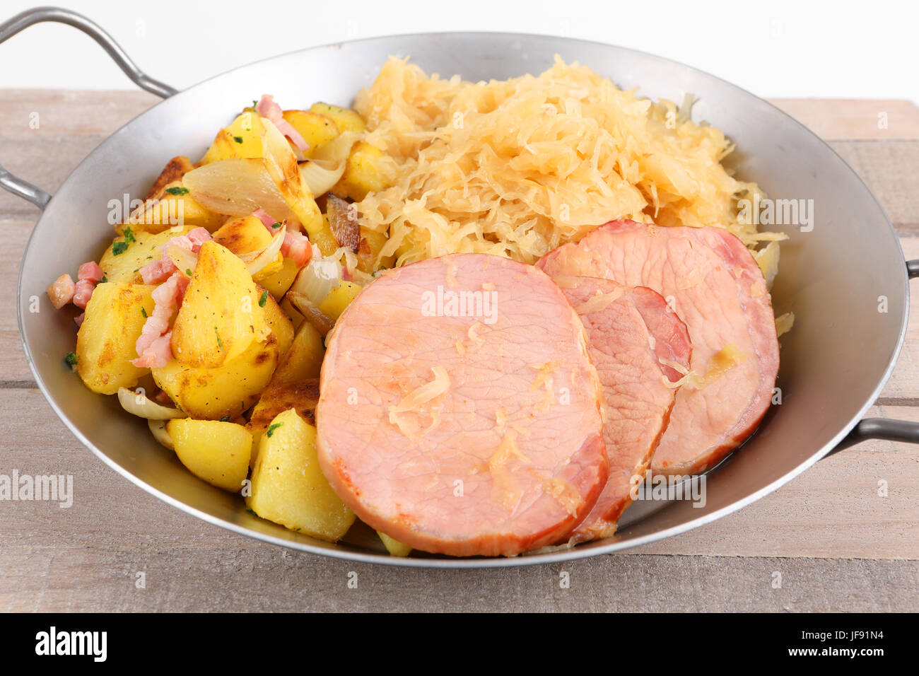 smoked pork chop with sauerkraut and fried potatoes Stock Photo Alamy