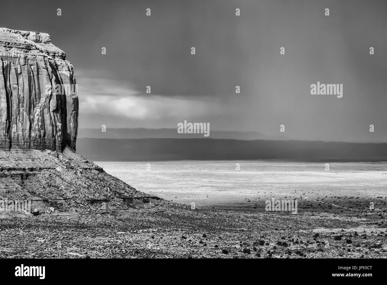 A single , majestic butte and stormy skies -Landscape- Monument Valley, Arizona Stock Photo