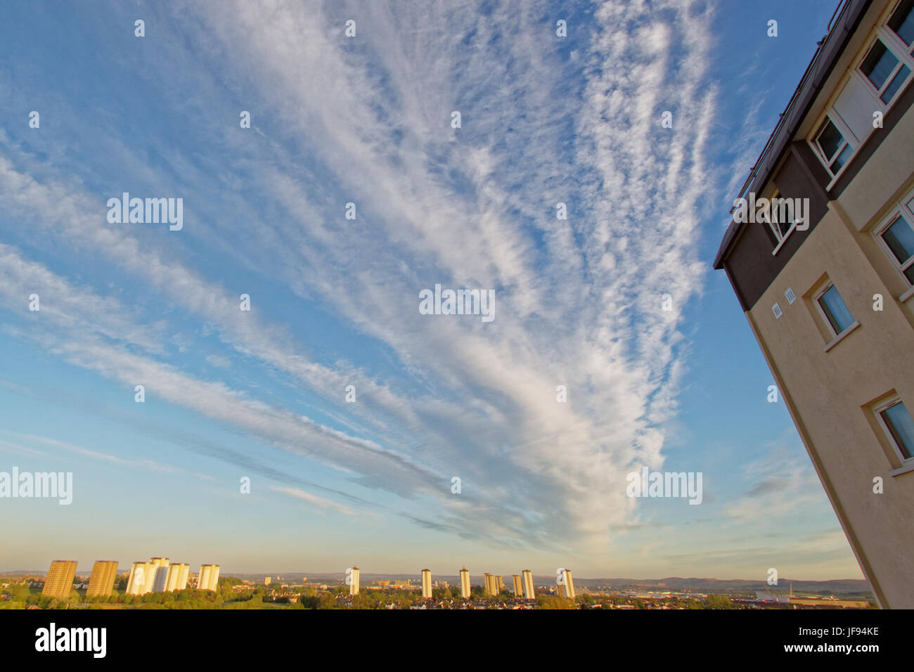 panoramic view of Glasgow high rise council flats with forefront flat indicator and dramatic sky to emphasize recent problems with this type  housing Stock Photo