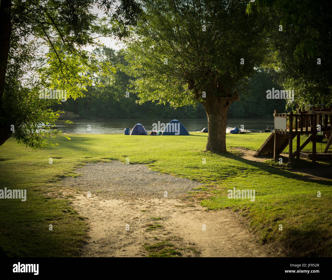 road leading to tourist camp with tents Stock Photo