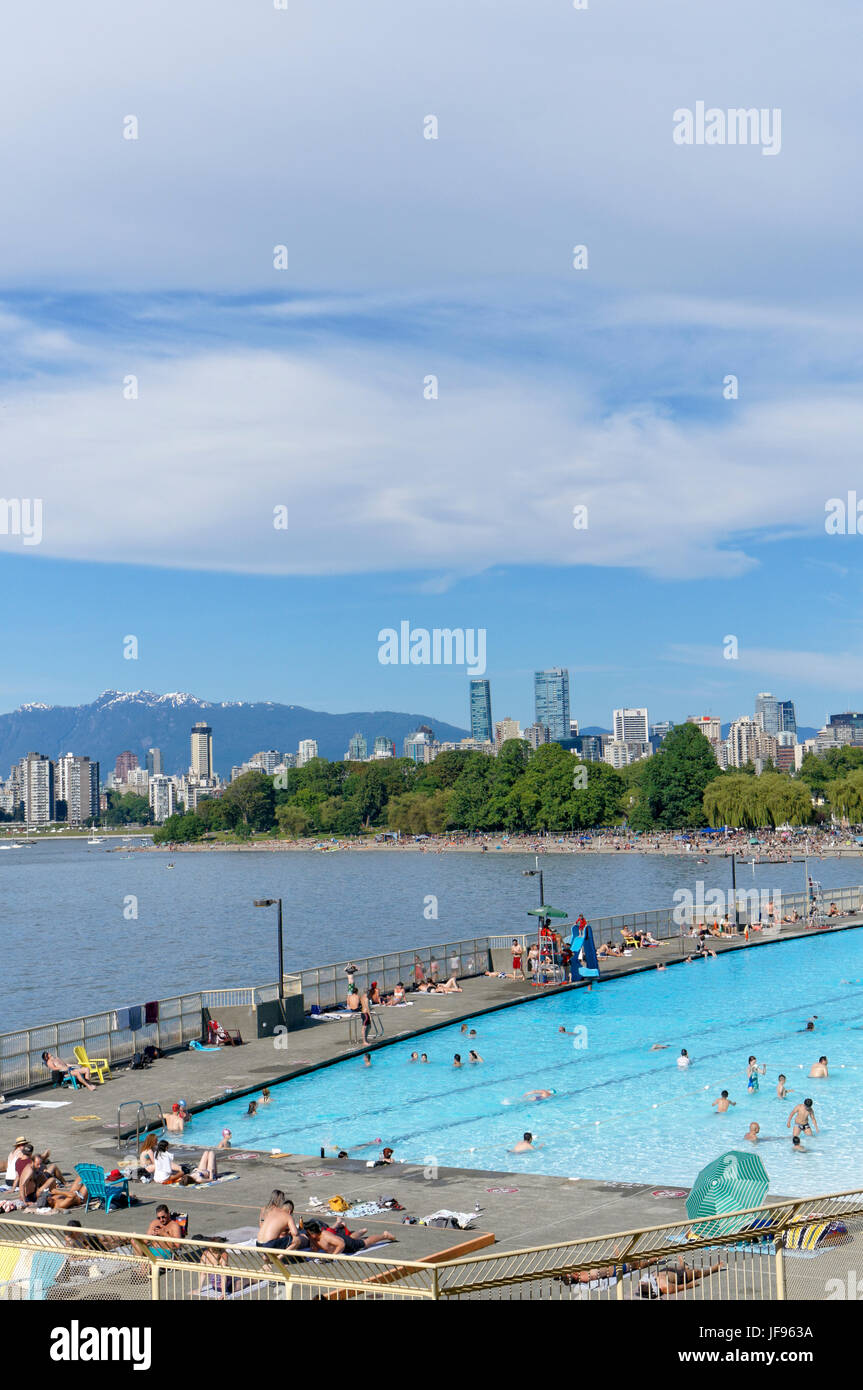 People sunbathing and swimming at Kitsilano Pool on English Bay, Vancouver, British Columbia, Canada Stock Photo