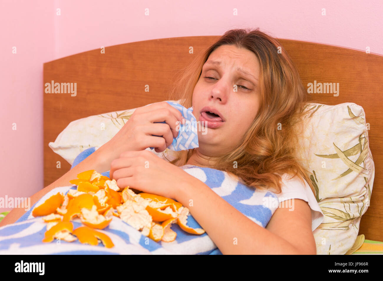 Young girl coughing heavily lying in bed Stock Photo Alamy