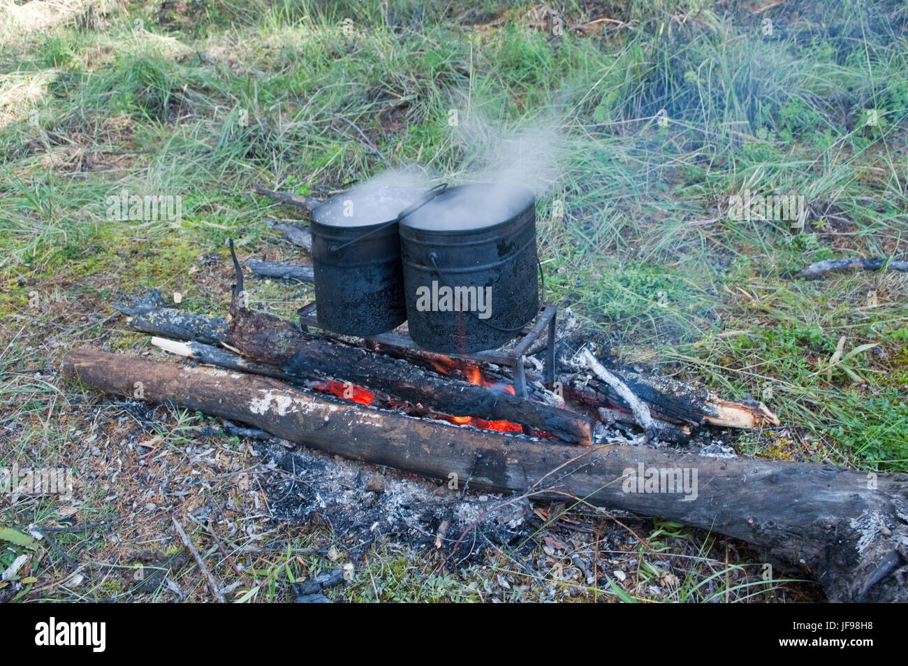Cooking on a fire. Cooking in field conditions spur the imagination of