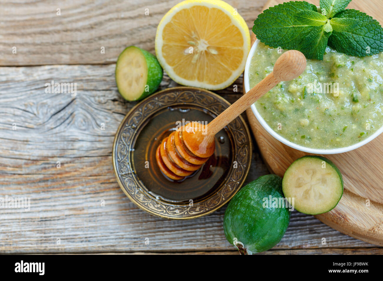 Vitamin cocktail of pineapple guava, lemon and honey in a cup Stock Photo Alamy