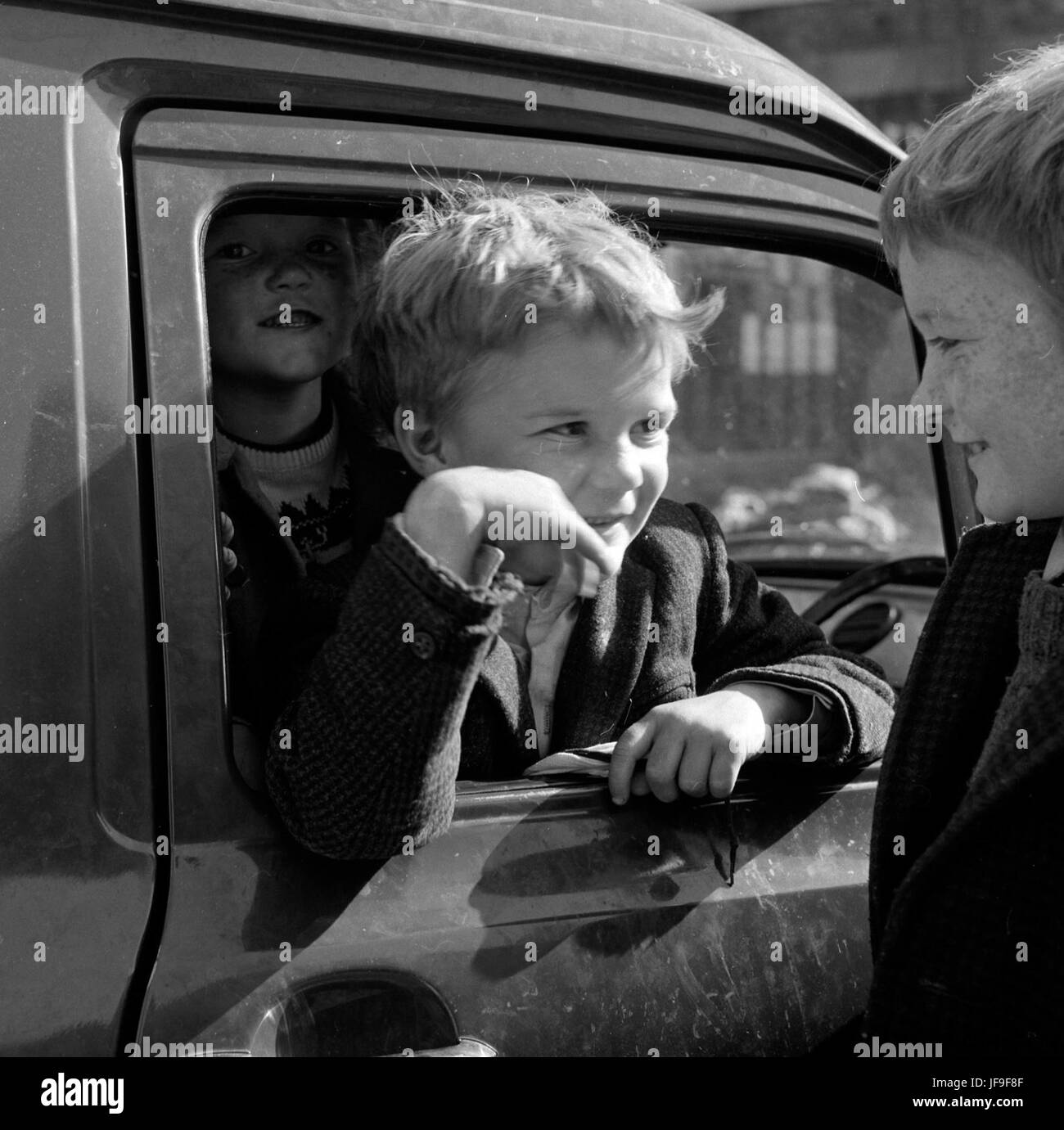 Boys Will Be Boys: 1960s Kids Enjoying a Day at Cumberland Street Market in Dublin Stock Photo