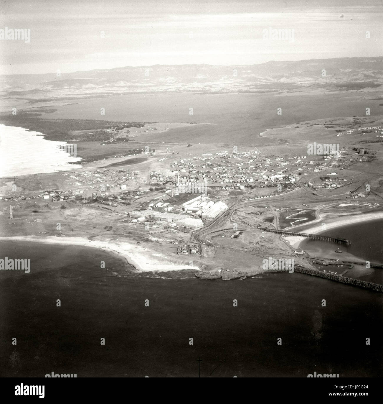 Port Kembla, as captured in 1937 aerial photographs, remains a significant location in Australian history and the Adastra Aerial Survey Collection. Stock Photo