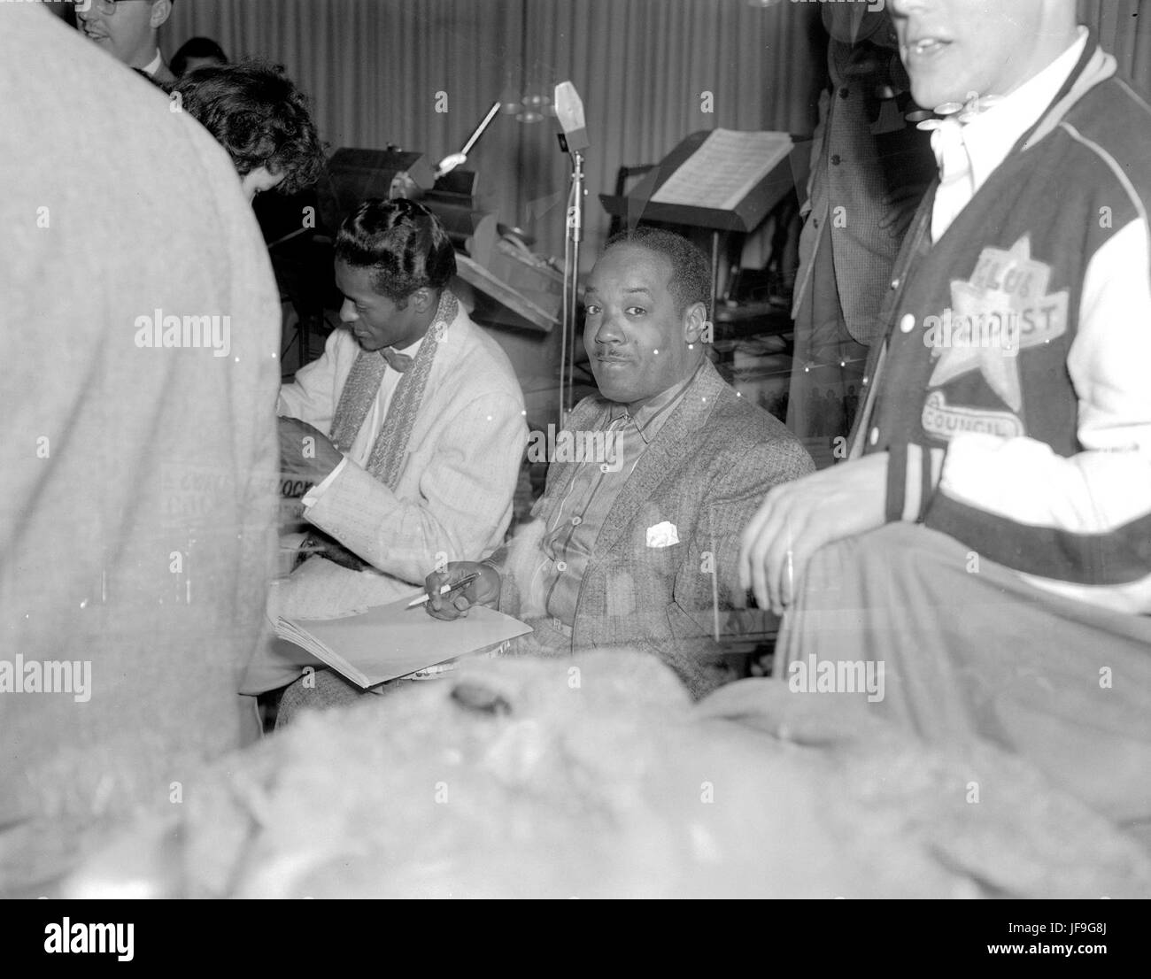 Rock 'n' roll legend Chuck Berry signing autographs at Edmonton Gardens, capturing a moment of music history in the making. Stock Photo