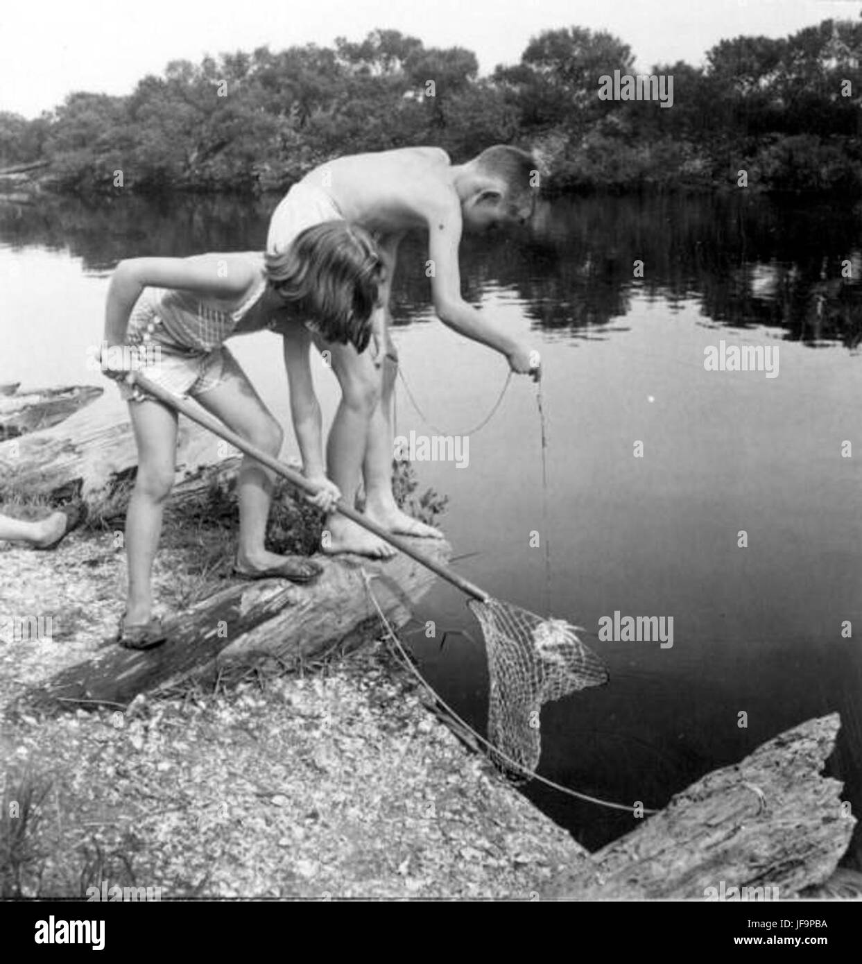 Gretchen and Peter Eben crabbing in San Pablo Creek - 35144115402 o Stock Photo