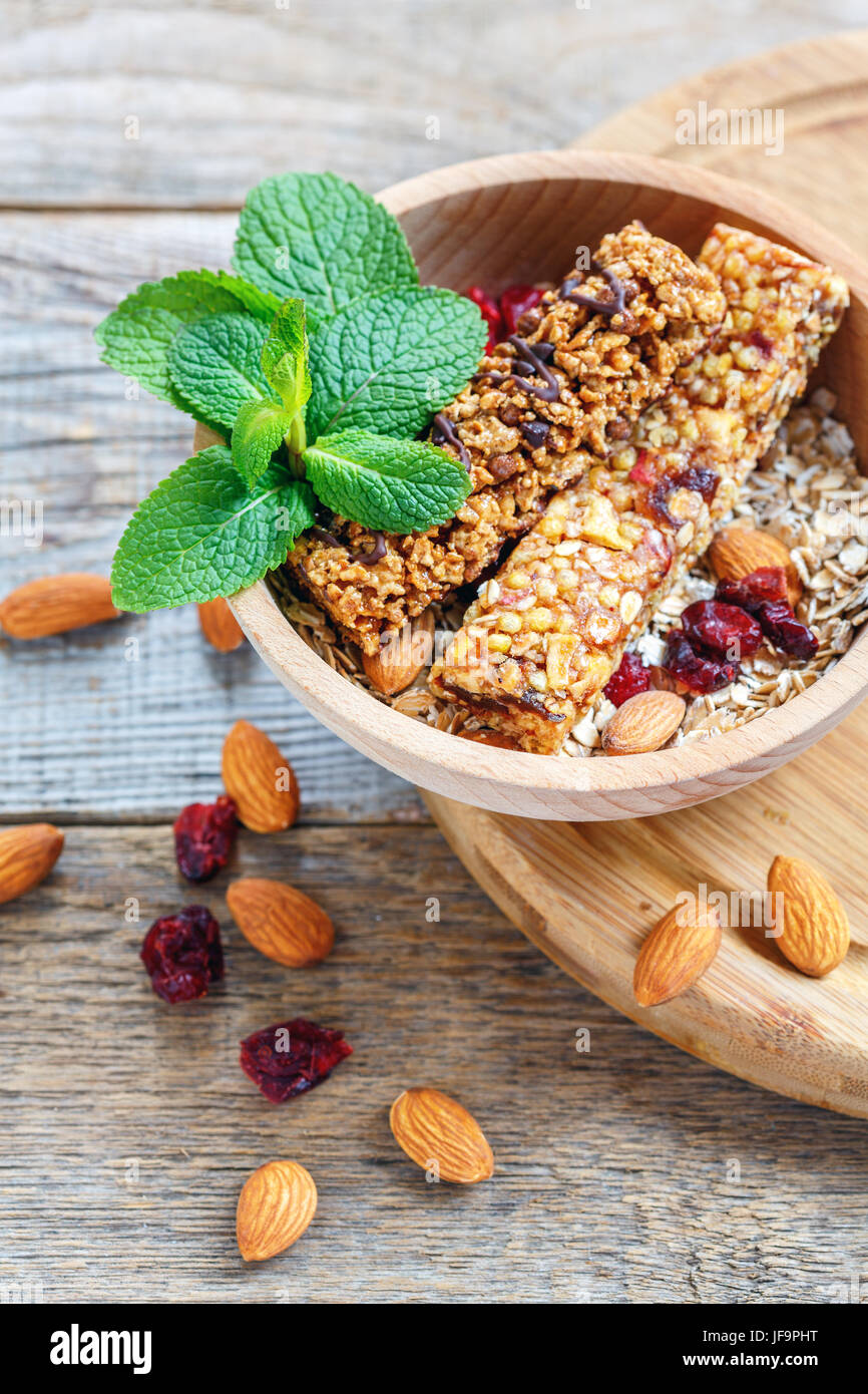 Homemade muesli bars in a wooden bowl. Stock Photo