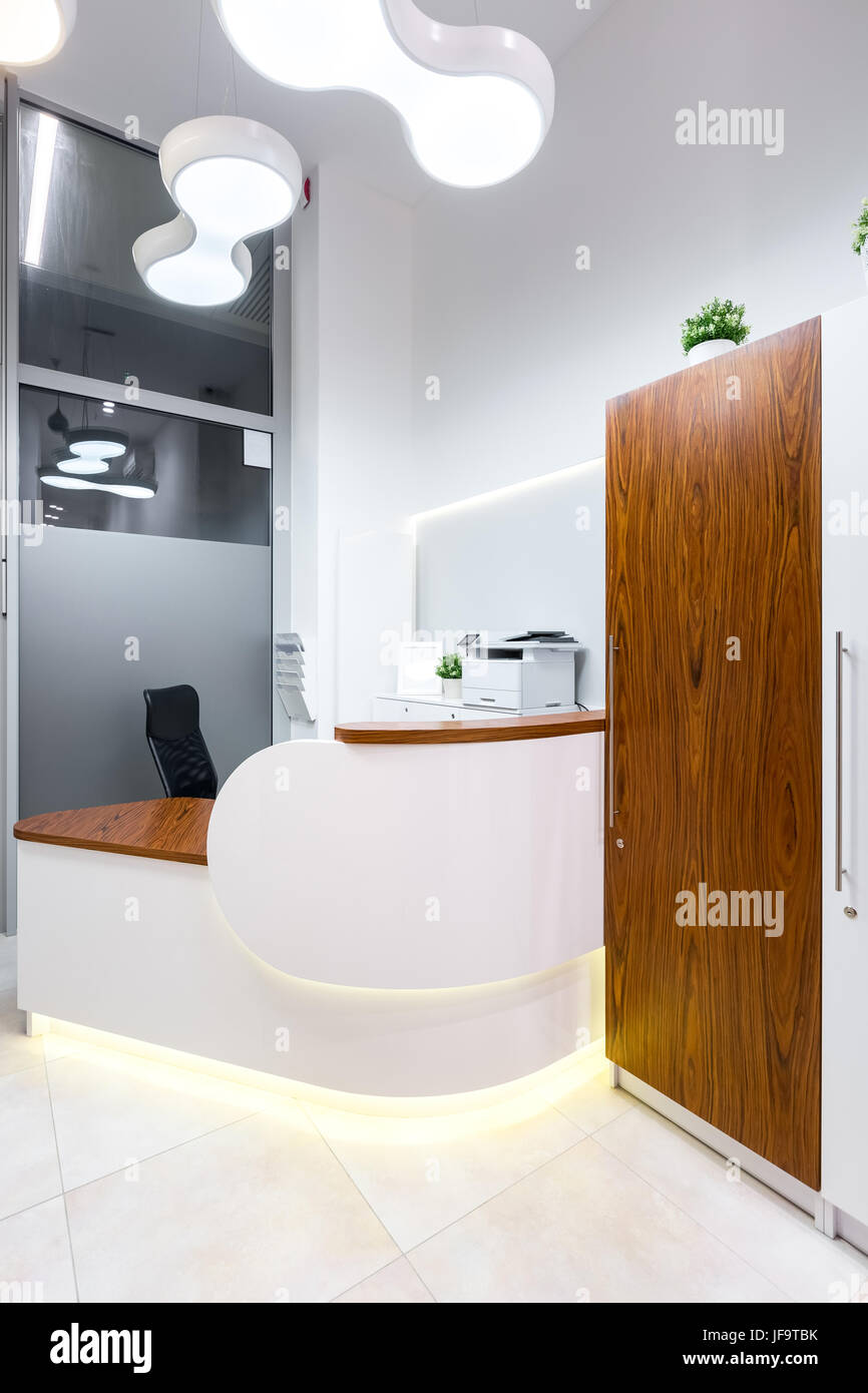 Contemporary Designed Front Desk With Supplies At Dental Office