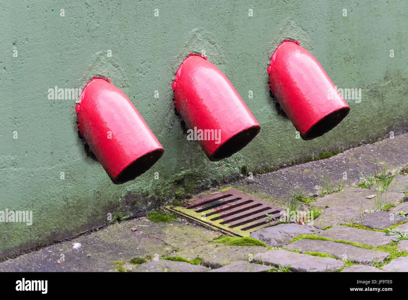 Rainwater downpipe with metal frame. Stock Photo