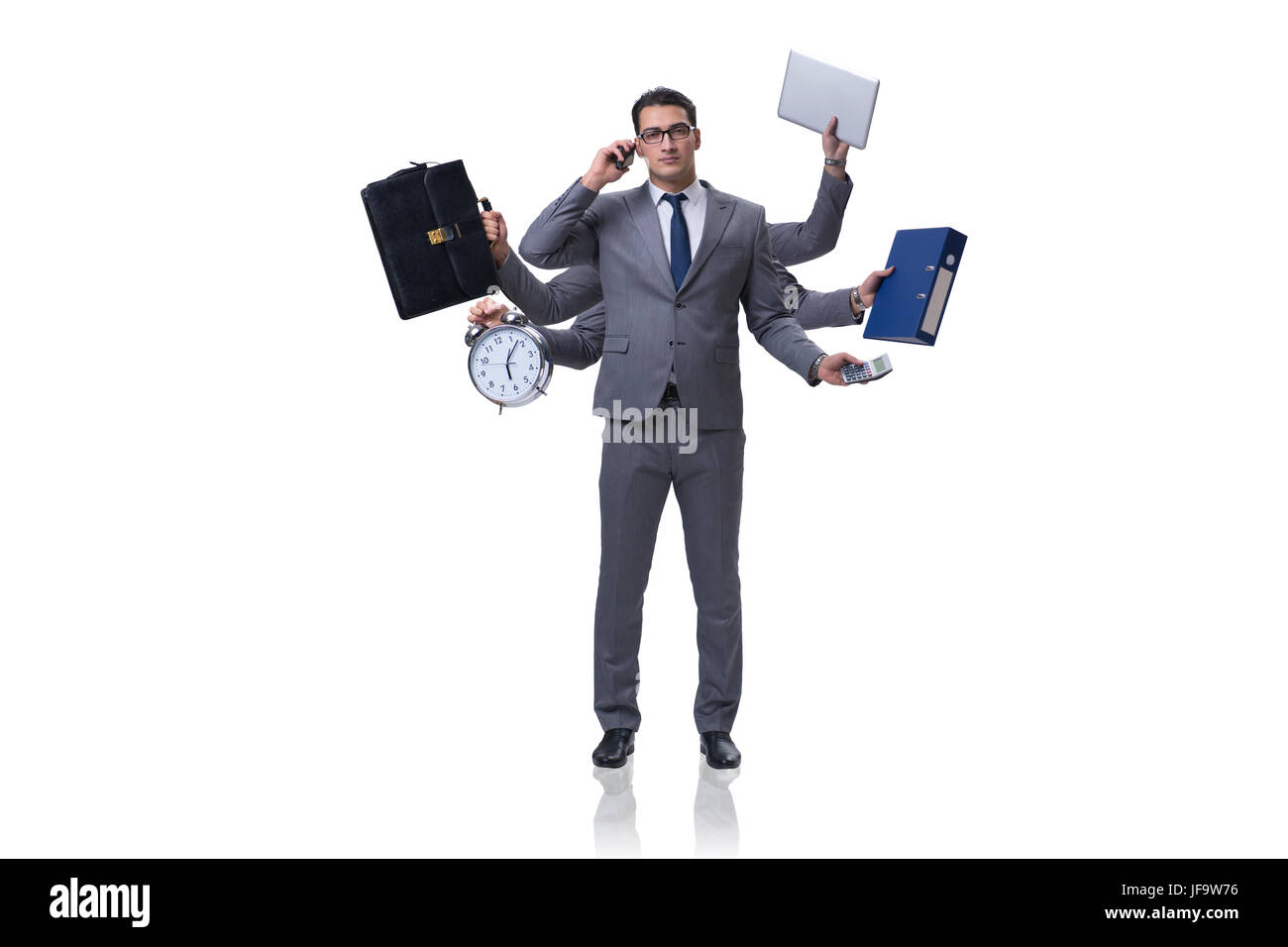 Young businessman in multitasking concept Stock Photo