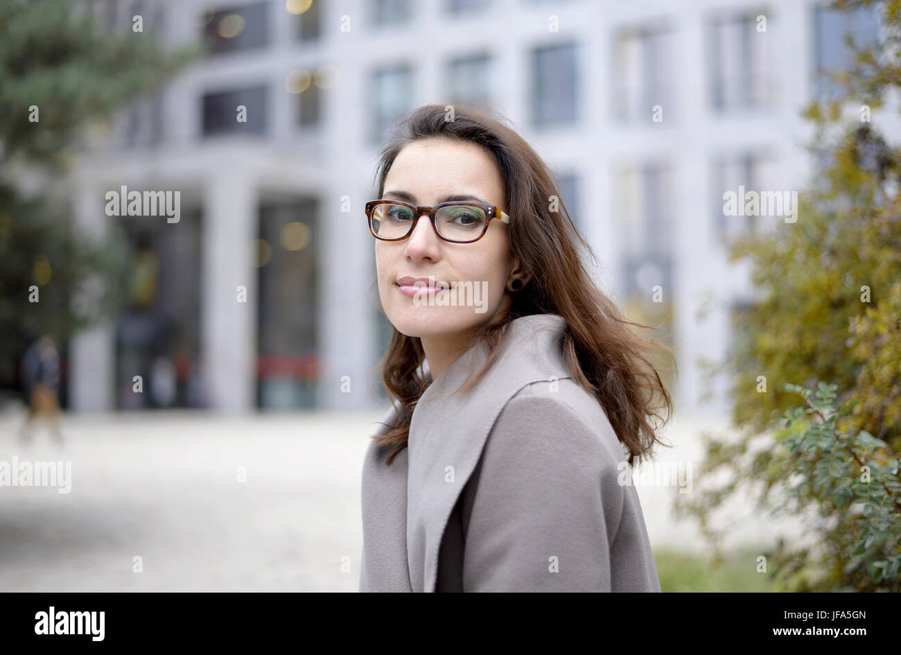 smiling businesswoman in the city Stock Photo