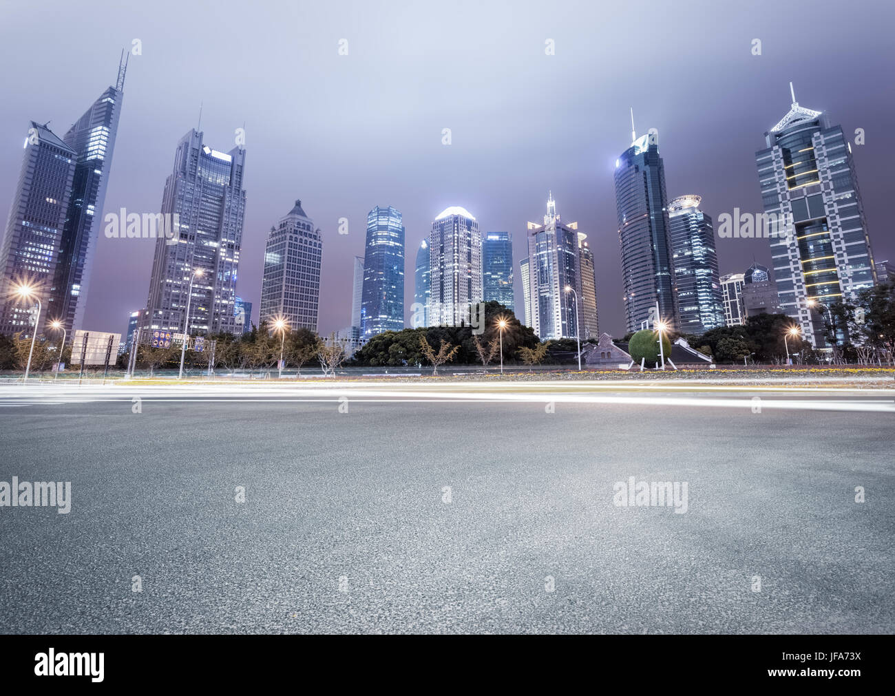 city avenue with modern buildings at night Stock Photo