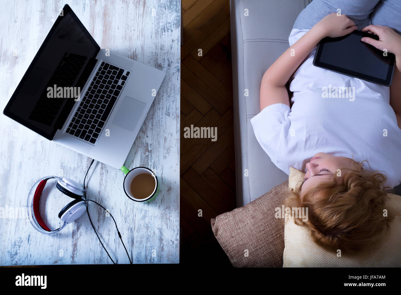 Falling asleep on the sofa at night Stock Photo Alamy
