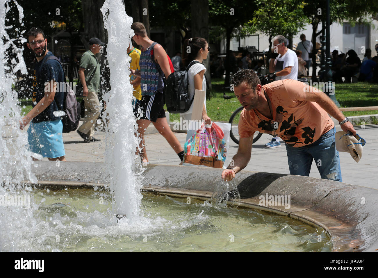 Athens. 29th June, 2017. People cool themselves down in Athens, Greece, on June 29, 2017 as temperature rises up to about 40 degrees Celsius. Credit: Marios Lolos/Xinhua/Alamy Live News Stock Photo