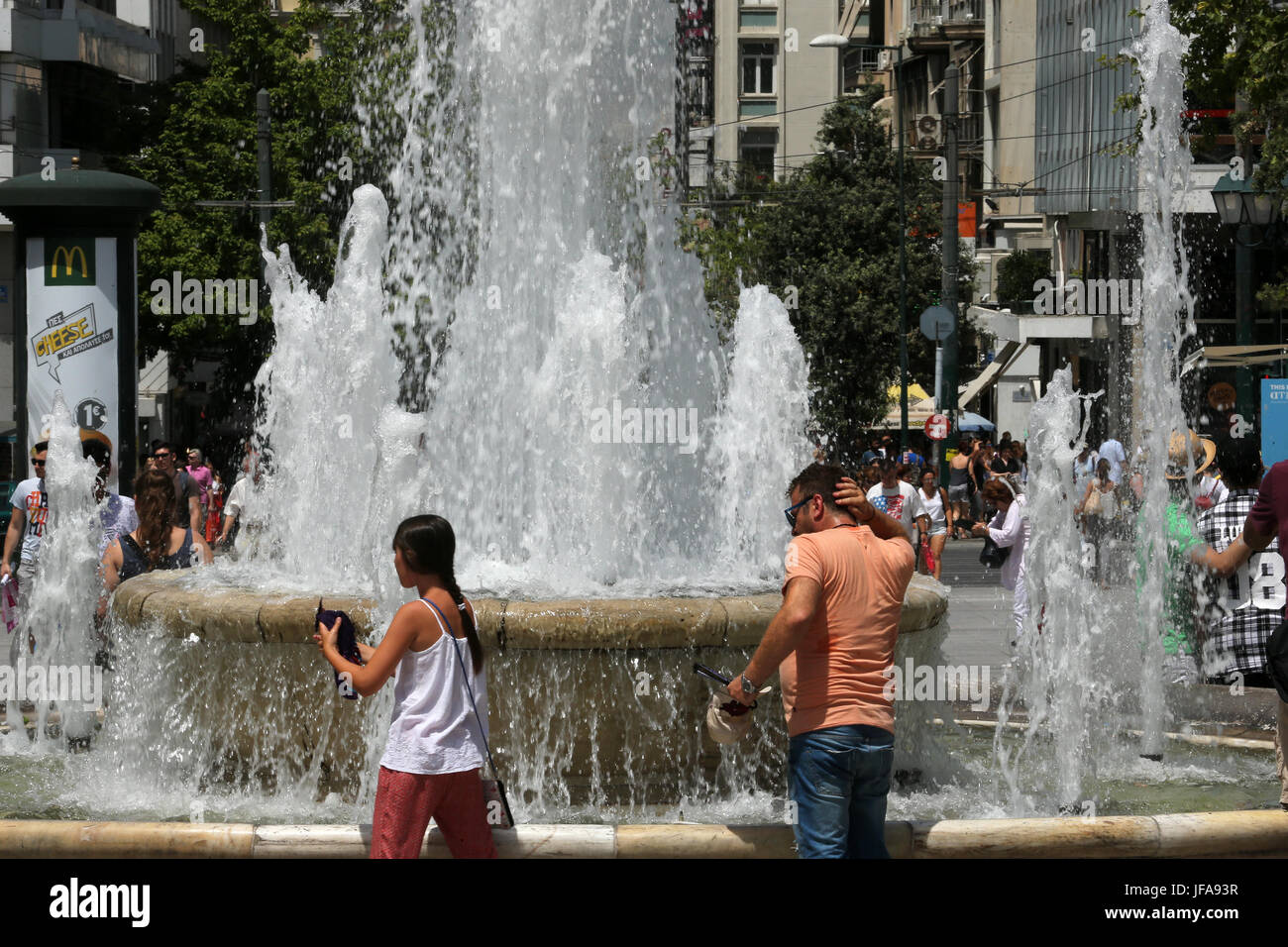 Athens. 29th June, 2017. People cool themselves down in Athens, Greece, on June 29, 2017 as temperature rises up to about 40 degrees Celsius. Credit: Marios Lolos/Xinhua/Alamy Live News Stock Photo