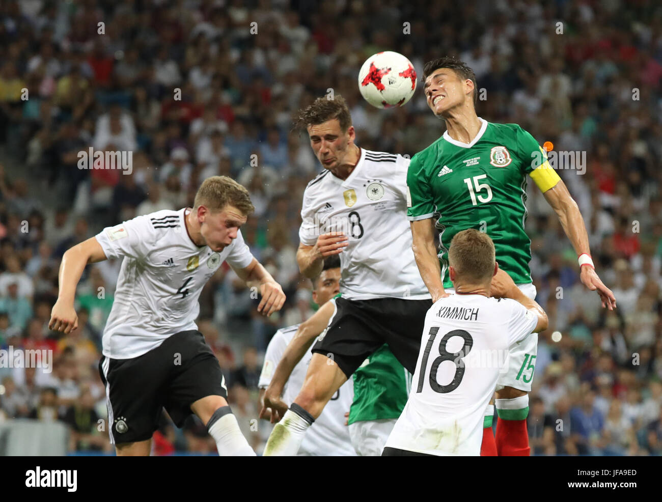 Sochi, Russia. 29th June, 2017. Leon Goretzka (top R2) of Germany competes for a header with Hector Moreno (top R1) of Mexico during the semifinal match of the 2017 FIFA Confederations Cup in Sochi, Russia, June 29, 2017. Germany won 4-1. Credit: Xu Zijian/Xinhua/Alamy Live News Stock Photo