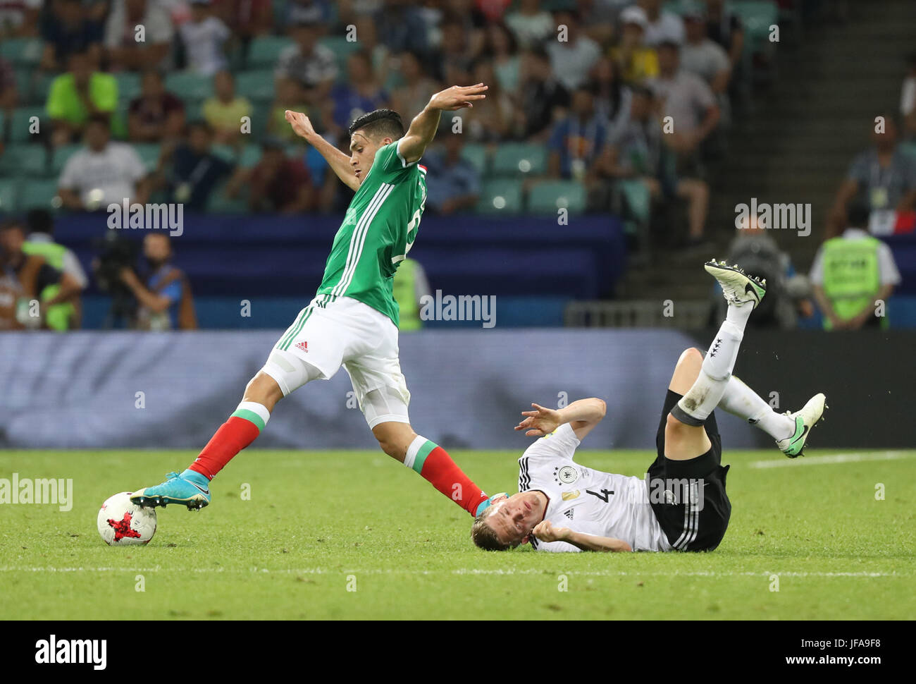 Sochi, Russia. 29th June, 2017. Matthias Ginter (R) of Germany vies with Raul Jimenez of Mexico during the semifinal match of the 2017 FIFA Confederations Cup in Sochi, Russia, June 29, 2017. Germany won 4-1. Credit: Xu Zijian/Xinhua/Alamy Live News Stock Photo