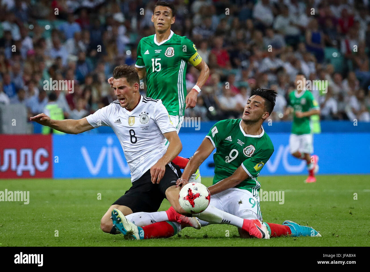 Sochi, Russia. 29th June, 2017. Germany's Leon Goretzka (L) is closed down by Mexico's Hector Moreno and Raul Jimenez (R) during the Confederations Cup semi-final between Germany and Mexico at the Fisht Stadium in Sochi, Russia, 29 June 2017. Photo: Christian Charisius/dpa/Alamy Live News Stock Photo