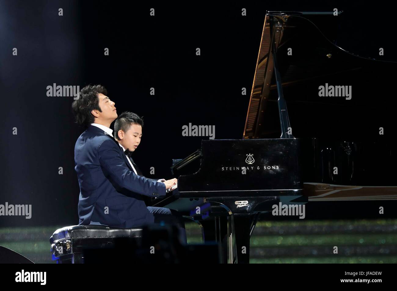 Hong Kong, China. 30th June, 2017. Pianist Lang Lang performs together