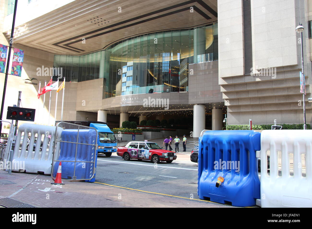 Barricades set up by police on Harbour Road, Wanchai, guarding President Xi Jinping in the Convention and Exhibition Centre opposite the fire station Stock Photo